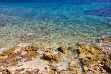 Stones in blue Adriatic sea water