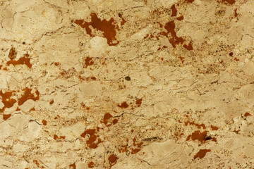 Golden marble texture of a natural white and golden stone tile.
