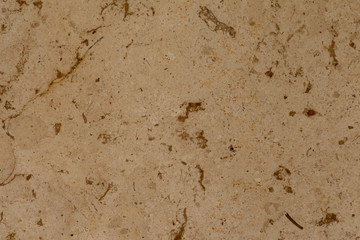 Golden marble texture of a natural white and golden stone tile.