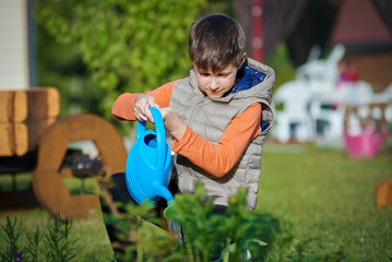 Country works on the personal plot, watering the garden. © Artem