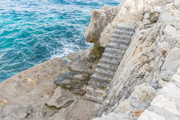 Ibiza, Mediterranean sea crashing against the rocks of the Spanish island of Mallorca, Ibiza, Spain.