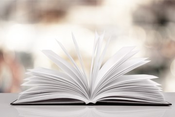 Open book on old wooden table