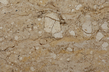Golden marble texture of a natural white and golden stone tile.