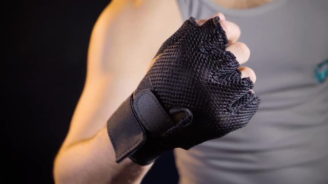 Man showing warmup in sport gloves