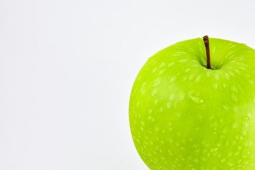 Close up the green apple have water droplets on the skin and have white background