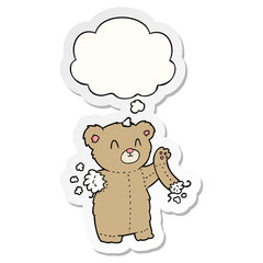 cartoon teddy bear with torn arm and thought bubble as a printed sticker
