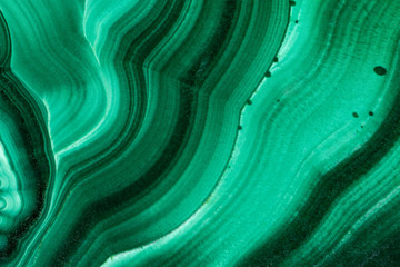 The green malachite. An ornamental stone. Photo texture. Macro.