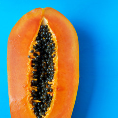 Half of tasty papaya with seeds