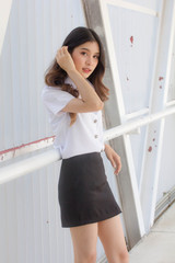 Portrait of thai adult student university uniform beautiful girl relax and smile