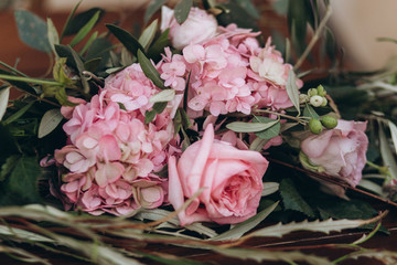 Wedding asymmetrical stylish bouquet with purple roses