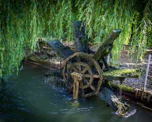 Wheel of an old watermill at a canal in wels austria