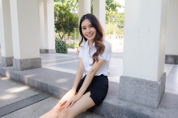 Portrait of thai adult student university uniform beautiful girl relax and smile