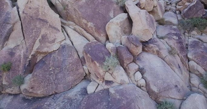 drone circling around boulders in Joshua  Tree national park with Native American Petroglyphs, Coyote Hole Canyon, yucca valley,california, mojave desert,