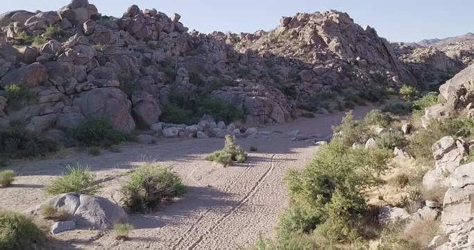 drone shot above beautiful landscape of Joshua Tree national park.  exploring pictographs, geoglyphs and Petroglyphs , Coyote Hole Canyon, Joshua tree, yucca valley,california