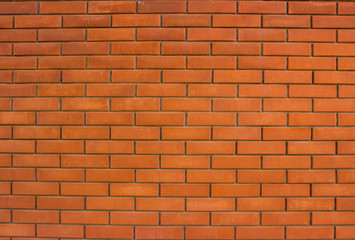 Obraz premium Classic brick wall made of red brick. Modern brickwork.