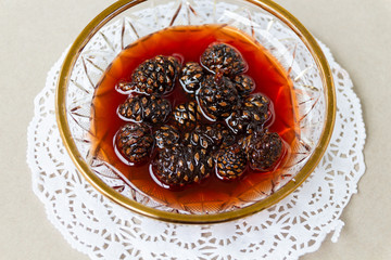 Jam from pine cones in jar.
