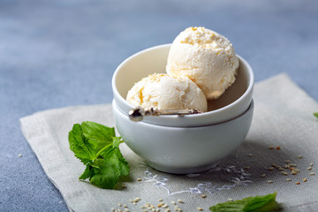 Artisanal ice cream balls with sesame seeds.