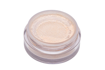 Face powder isolated. Closeup of translucent loose powder for face in a open jar isolated on white background. Concept beauty.