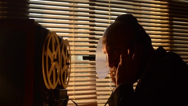 FBI secret agent listens and records the conversation on the tape, the microphone is aimed at people