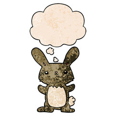 cute cartoon rabbit and thought bubble in grunge texture pattern style