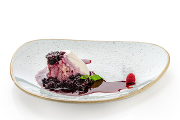 Dessert dish with raspberries and jam. Close-up.