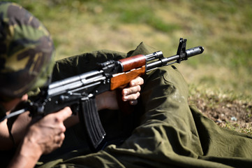 Outdoor target shooting with assault rifle