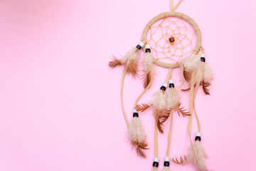 Dreamcatcher on pink background