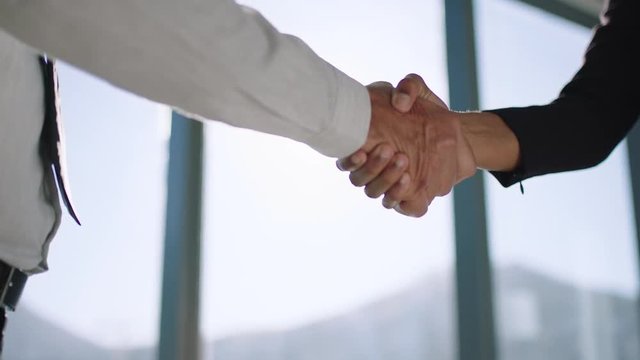 close up handshake business people shaking hands successful corporate partnership deal welcoming opportunity for cooperation in office 4k footage
