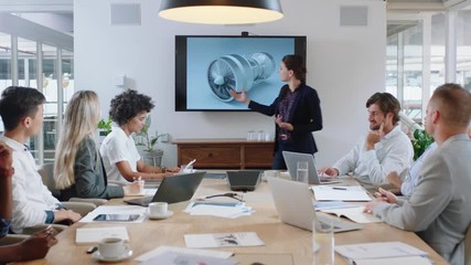 business people meeting in boardroom engineer woman presenting turbine design on tv screen sharing technical briefing with colleagues discussing ideas in office presentation