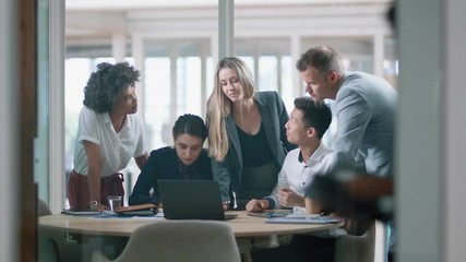 business people brainstorming using laptop computer team leader woman pointing at screen sharing creative ideas helping colleagues discussing project teamwork in modern office 4k - Powered by Adobe