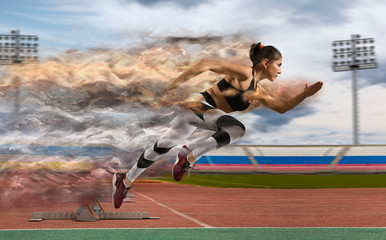 Woman sprinter leaving starting blocks on the athletic track
