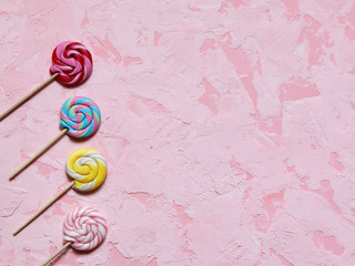 Bright candys on abstract pink background