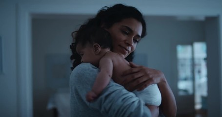 mother holding baby gently soothing infant calming her newborn child mom caring for toddler at night 4k - Powered by Adobe