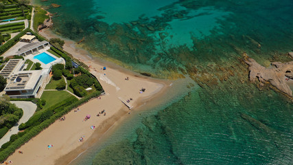 Aerial drone bird's eye view photo of iconic rock volcanic tropical islet with emerald clear water sea