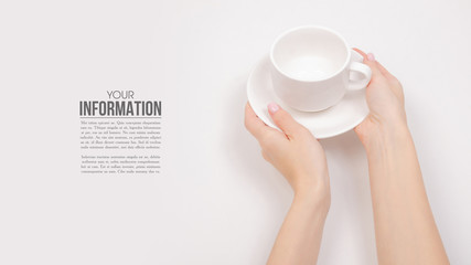 White saucer cup in hand, sample text on white background isolation