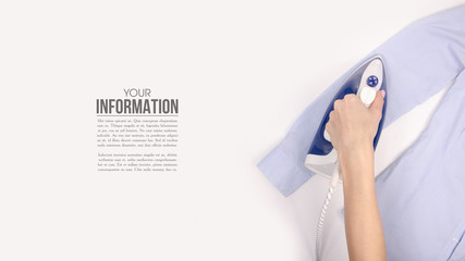 Blue iron in hand blue shirt on ironing board top view, household, sample text on white background...