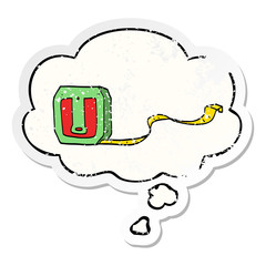 cartoon tape measure and thought bubble as a distressed worn sticker