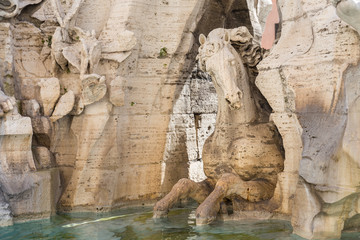 Detail of Horse from Four Rivers Fountain (Fontana dei Quattro Fiumi) in Navona Square, Rome, Italy.