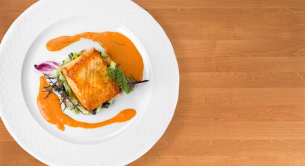 Grilled Salmon Steak  with Spinach, Tartare Cream and Lemon Wedges