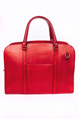 Red female leather bag isolated on white background