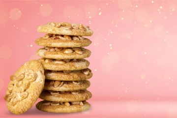 Delicious stacked cookies with nuts isolated on white background