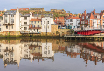 Obraz premium Reflections in Whitby harbour.