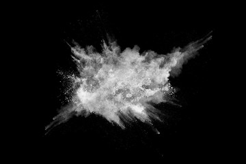 White powder explosion on black background. Colored cloud. Colorful dust explode. Paint Holi.