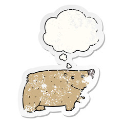 cartoon bear and thought bubble as a distressed worn sticker