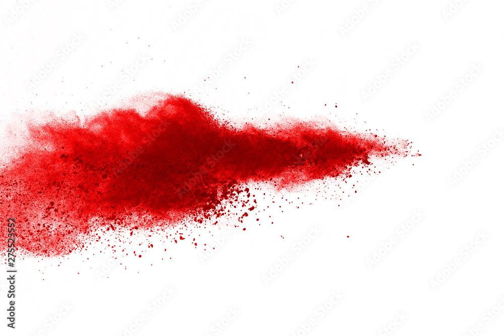 Wall mural freeze motion of red powder exploding, isolated on white background. abstract design of red dust clo