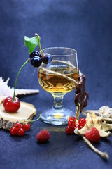 glass of white wine with fruits and berries