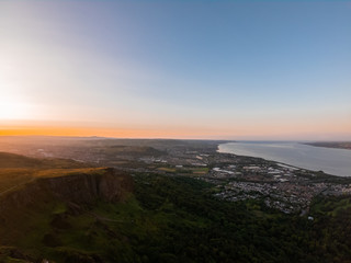 Obraz na płótnie Canvas Colorful sunset at Cave Hill Country Park Belfast, Northern Ireland. Aerial view on City and hills 