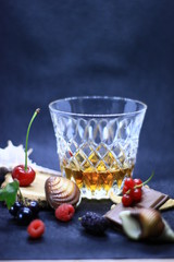 a glass of crystal with whiskey