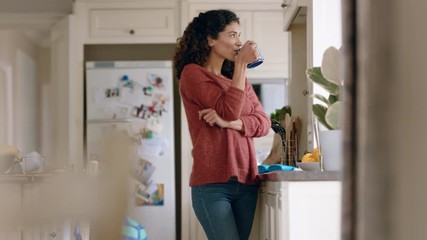 beautiful happy woman drinking coffee at home looking out window thinking of future planning ahead enjoying comfortable lifestyle
