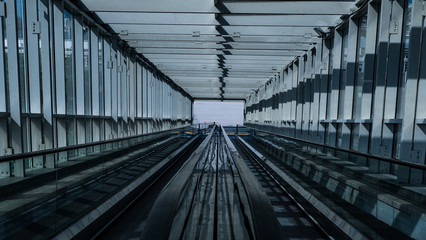 two industrial-style escalators surrounded by metal construction